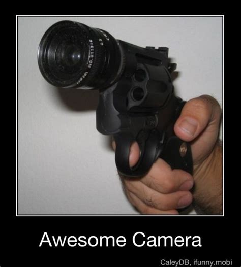 A Person Holding A Camera And Pointing It At The Camera With Their Thumb On The Lens