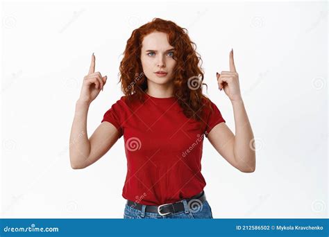 Disappointed Frowning Redhead Woman Pointing Finger Right At Something Bad Scolding Or