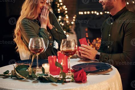 Man Proposing A Beautiful Woman To Marry Him In An Elegant Restaurant