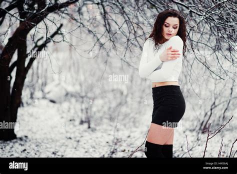 Curly Brunette Girl Background Falling Snow Wear On Black Mini Skirt And Wool Stockings Model