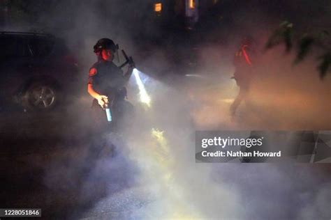 Police Officer Pepper Spray Photos And Premium High Res Pictures