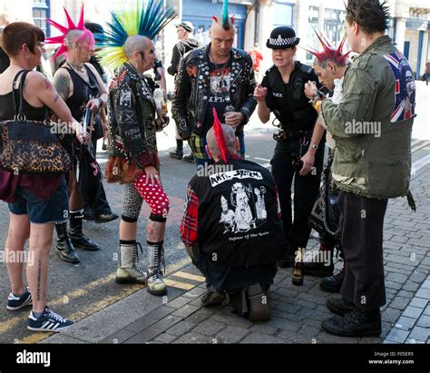 Police Woman With A Group Punk Rockers Rebel Rebelling Rebellion