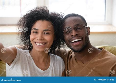 Close Up Headshot Portrait Of African American Couple Taking Selfie