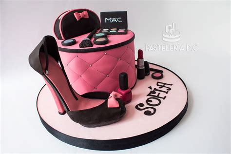 A Pink Cake With High Heel Shoes And Cosmetics On Top