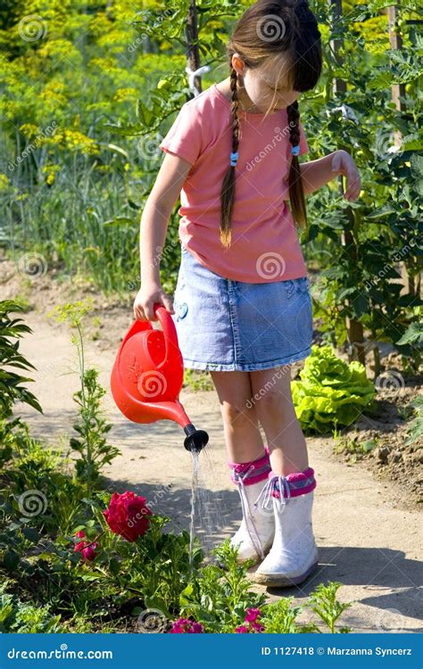 Girl With Watering Can Royalty Free Stock Photos - Image: 1127418