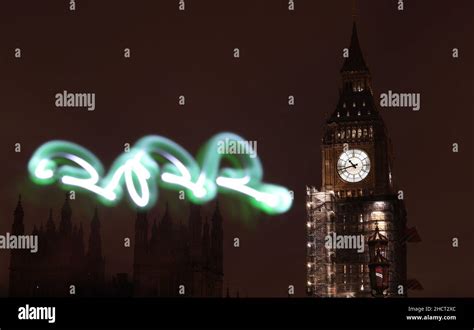 London, UK. 31st Dec, 2021. Photo taken on Dec. 31, 2021 shows the Big Ben with the light ...