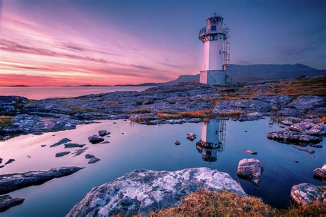 Rhue Lighthouse Reflection At Sunset Photograph By John Frid Fine Art