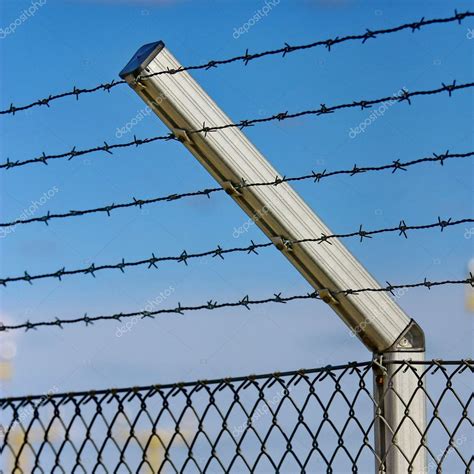 Razor wire fence — Stock Photo © ELINA #10224130