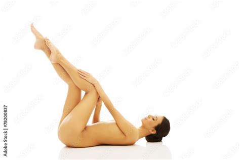 Nude Woman Lying On The Floor With Legs Up Stock Photo Adobe Stock