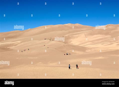 People Hiking In The Tallest Sand Dunes In North America Great Sand