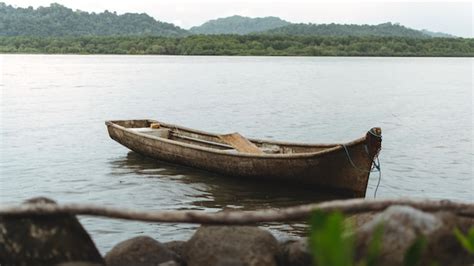 Premium Photo Boat Moored On Lake