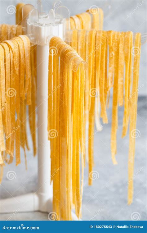 Homemade Italian Tagliatelle Hanging On A Pasta Drying Rack Fresh