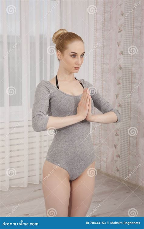 Beautiful Blonde Woman Practicing Yoga Stretching At Home On Blue Mat