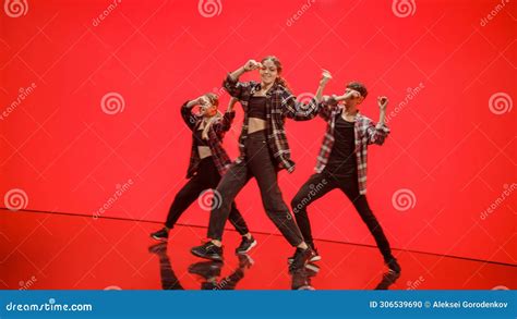 Diverse Group Of Three Professional Dancers Performing A Hip Hop Dance