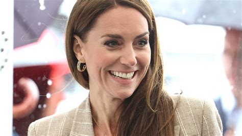 Kate Middleton Braves The Rain In Chic Pinstripe