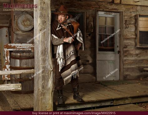 Cowboy Standing On A Porch American Wild West Villain Stock Photo Mxi22915