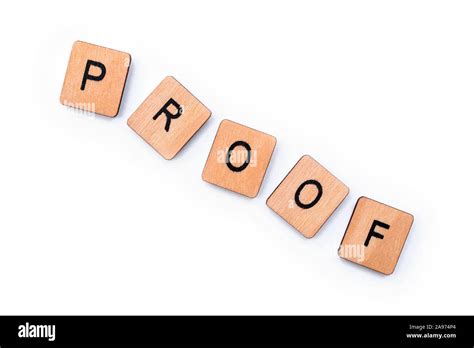 The Word Proof Spelt With Wooden Letter Tiles Over A Plain White