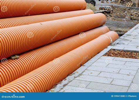 Plastic Pvc Pipes Stacked In Rows At A Construction Site On