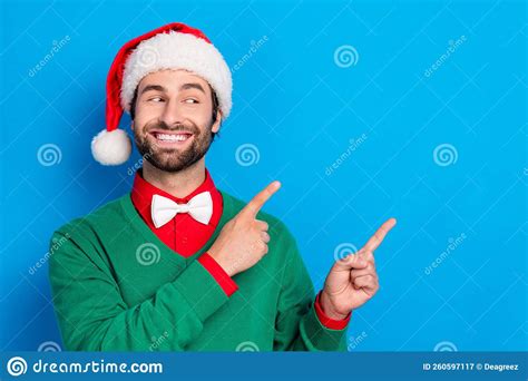 Photo Of Positive Handsome Guy Look Direct Fingers Empty Space X Mas Proposition Isolated On