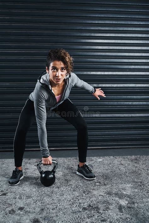 Outdoor Fitness Or Woman Lifting Kettlebell In Training Workout Or