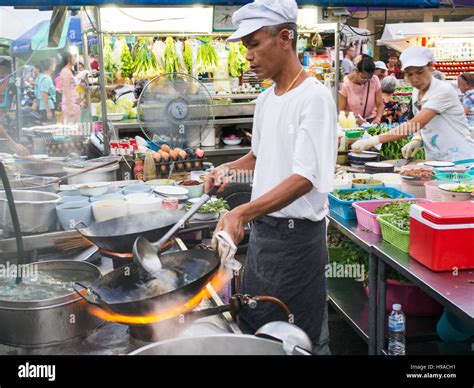 A Cook Preparing Food At The Night Market In Hua Hin Thailand Stock