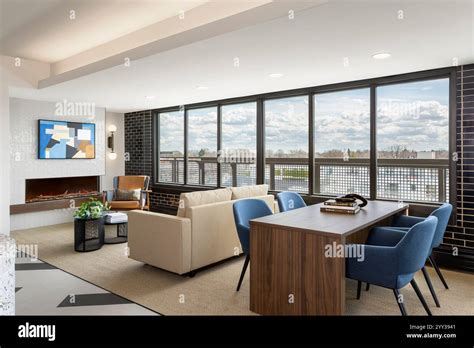 Seating Area With Fireplace In Community Room On Top Floor Of Apartment