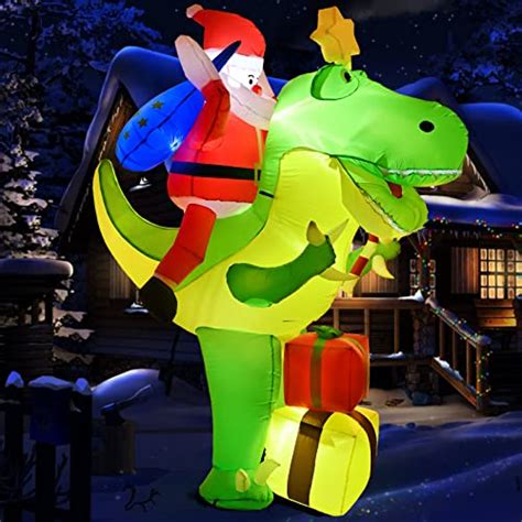 Santa Brings Christmas Cheer By Riding A Giant Dinosaur Inflatable