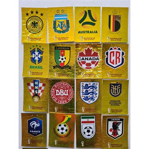 Figurinha Copa Qatar 2022 Panini Seleções Douradas Escudos Estadio