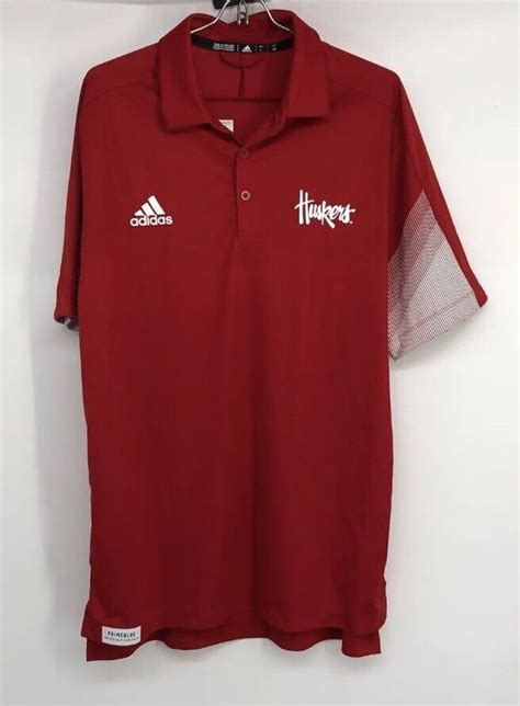 NEW Men Adidas NCAA University Nebraska Cornhusker Prime Blue Polo