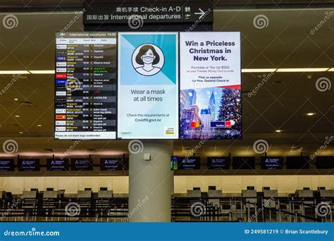 Arrivals Display Board At Airport Terminal Showing International