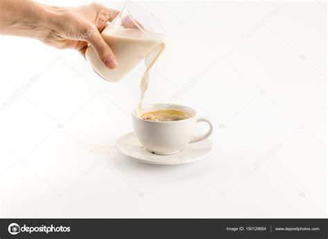 Pouring Milk Into Coffee — Stock Photo © Vikakhalabuzar 150129664