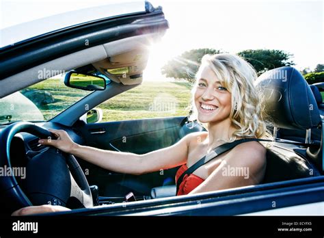 Caucasian Woman Driving Convertible Stock Photo Alamy