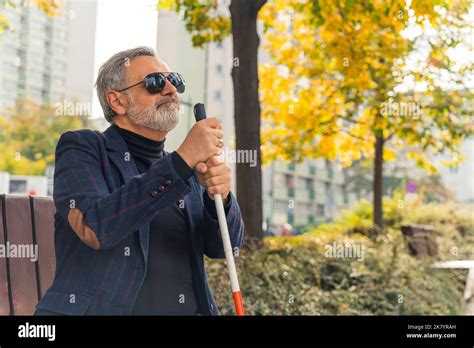 Elegant Blind Bearded Grey Haired Mature Man With Dark Sunglasses On