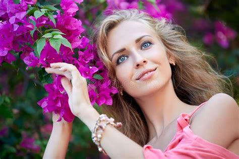 Close Up Portrait Of Blonde Woman Posing In The Park Stock Image