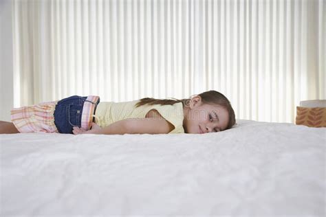 Happy Little Girl Lying in Bed Stock Photo - Image of pretty, childhood ...