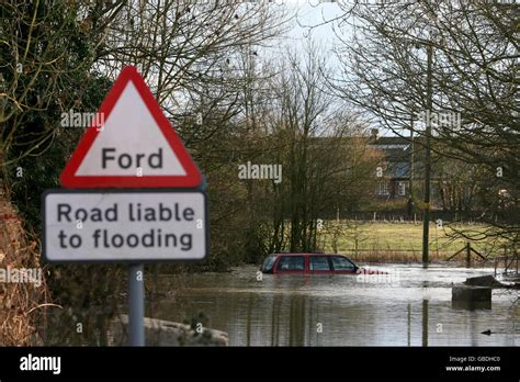 A Car Is Submerged In Floods As The River Can Bursts Its Banks Near