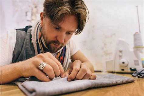 Caucasian Man Hand Sewing By Stocksy Contributor VISUALSPECTRUM