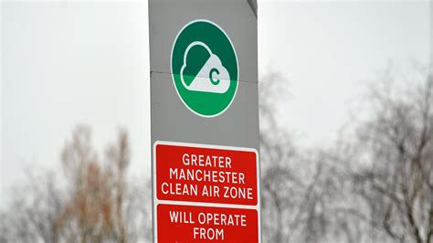 Stickers covering up Greater Manchester's Clean Air Zone signs to cost ...