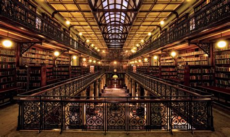 The Inside Of A Large Library With Lots Of Books