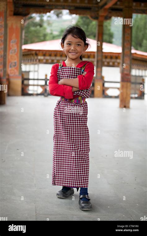 Young Bhutanese Girl In Traditional Clothes Smiling Stock Photo Alamy