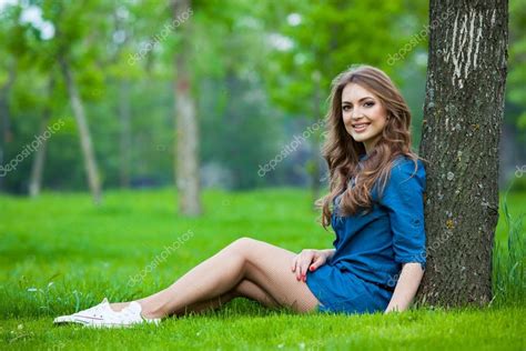 Portrait Of A Beautiful Blonde Outdoors In The Park Stock Photo Satyrenko
