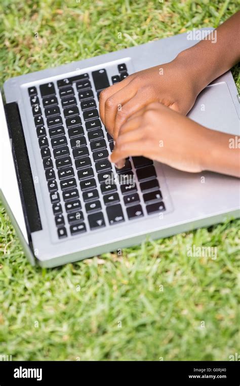 Kid typing laptop hi-res stock photography and images - Alamy