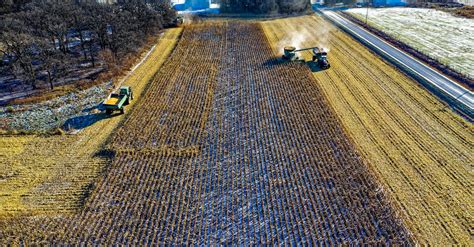 Farm Tractor Harvesting on Field · Free Stock Photo