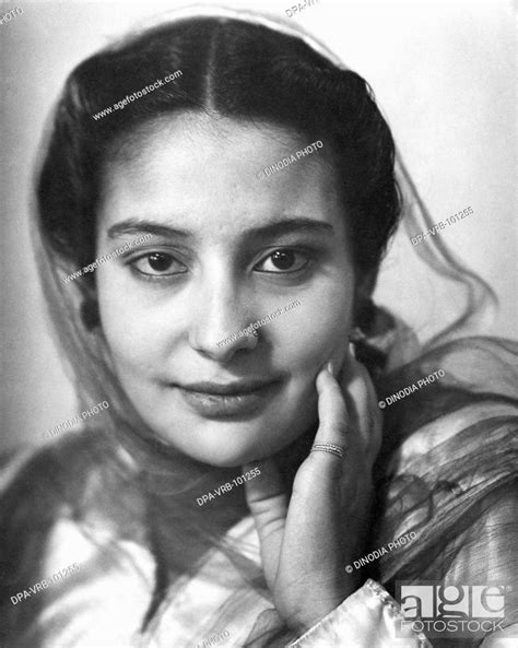 Indian Woman In Traditional Dress Head Covered Looking At Camera