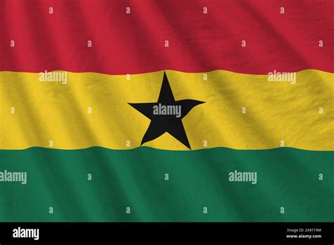 Ghana Flag With Big Folds Waving Close Up Under The Studio Light