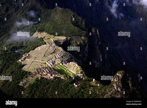 View Of Sunrise Over The Ancient Inca Ruins At Machu Picchu Near Cusco