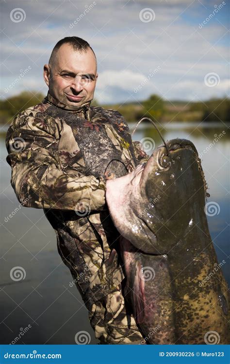 Fisherman Holding A Giant Catfish Stock Photo Image Of Fauna Angler