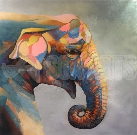 An Elephant Painted With Multicolors On Its Face