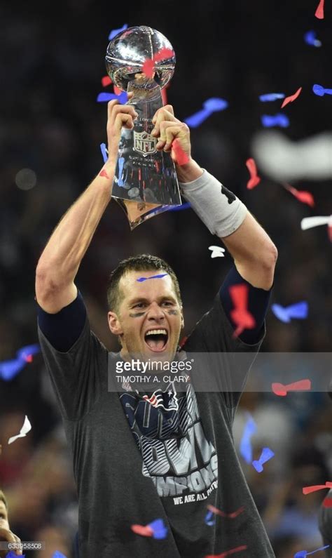 Tom Brady Of The New England Patriots Holds The Lombardi Trophy After