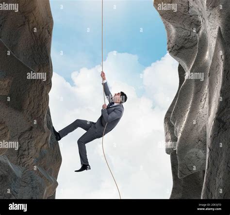 The Businessman Overcoming Challenges In Business Concept Stock Photo